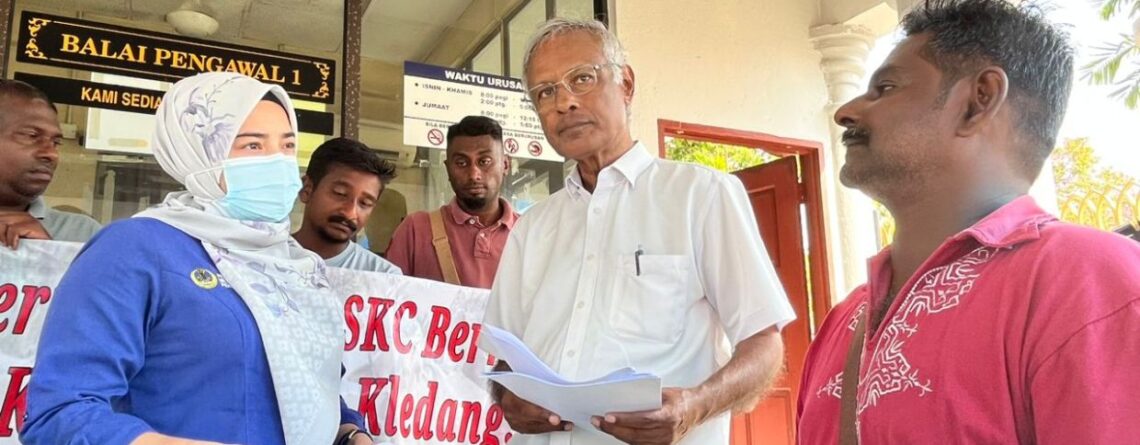 M Nanthakumar (right) handing in the memorandum to Mentri Besar office officer Nurul Shafyqah Yakimin Yuri Yakimin (left) and witnessed by PSM chairman Dr Michel Jeyakumar (middle) at the State Secretariat Building